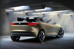 Sharply cut rear doors, sharp rear windscreen rake and a blackened-out roof spoiler lead on from the contrast roof. 